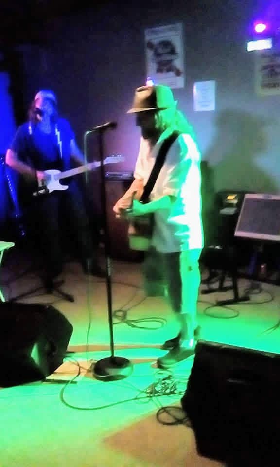 Dennis Bain playing guitar live